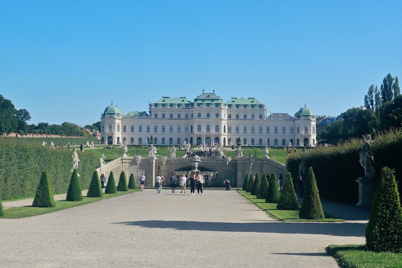 Belvedere Palace and gardens in Vienna under clear blue skies with green lawns