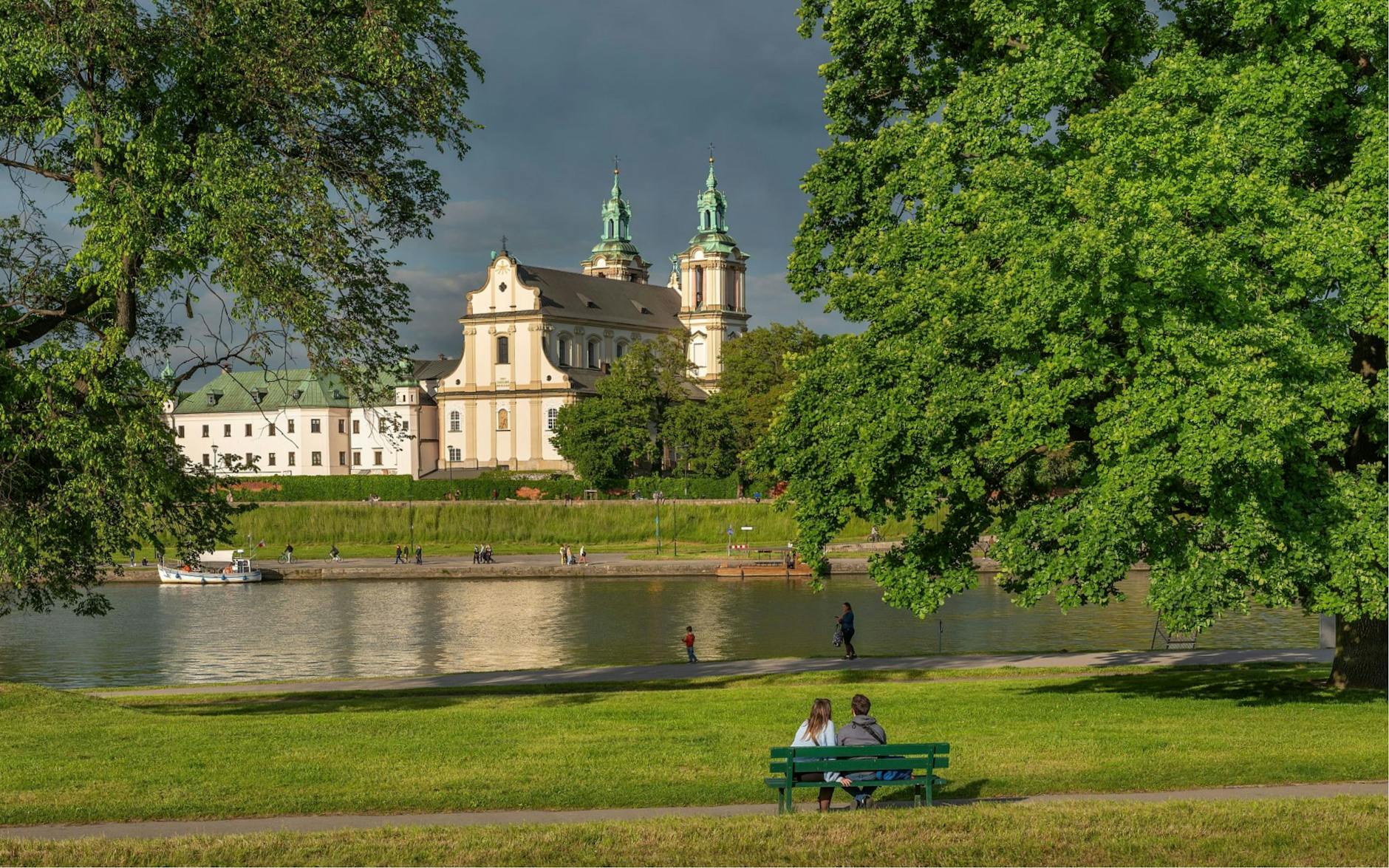 The Vistula River and Church of St Joseph in Krakow on a calm day