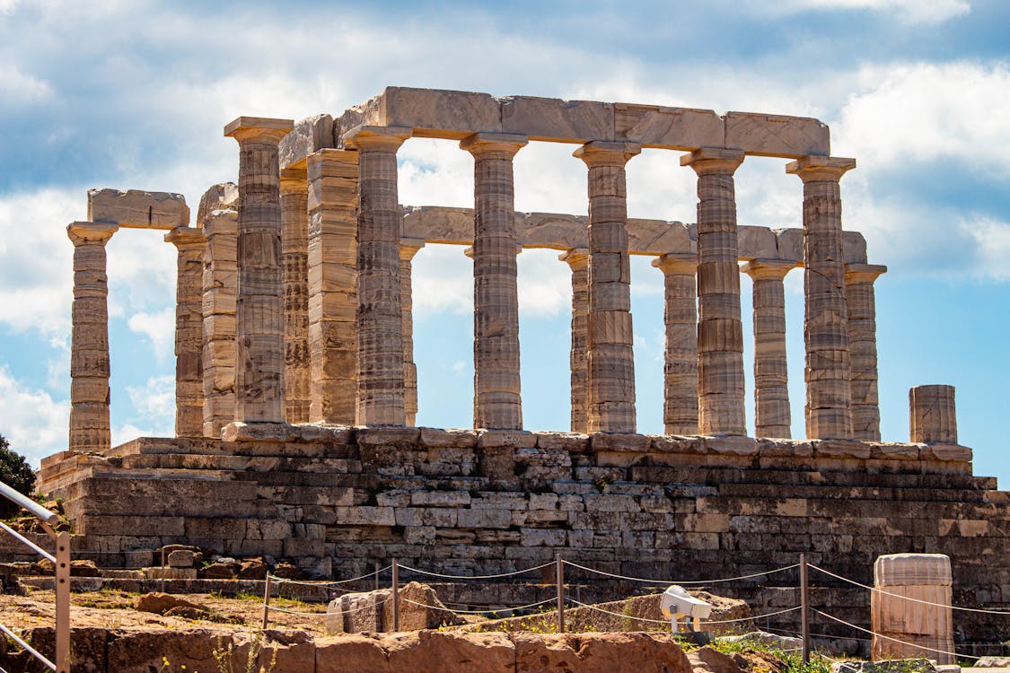 Ancient Temple of Poseidon with blue sky at Cape Sounion Greece
