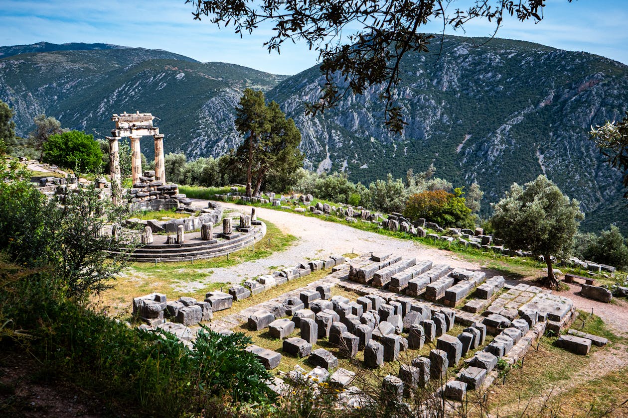Delphi archaeological ruins against mountain backdrop
