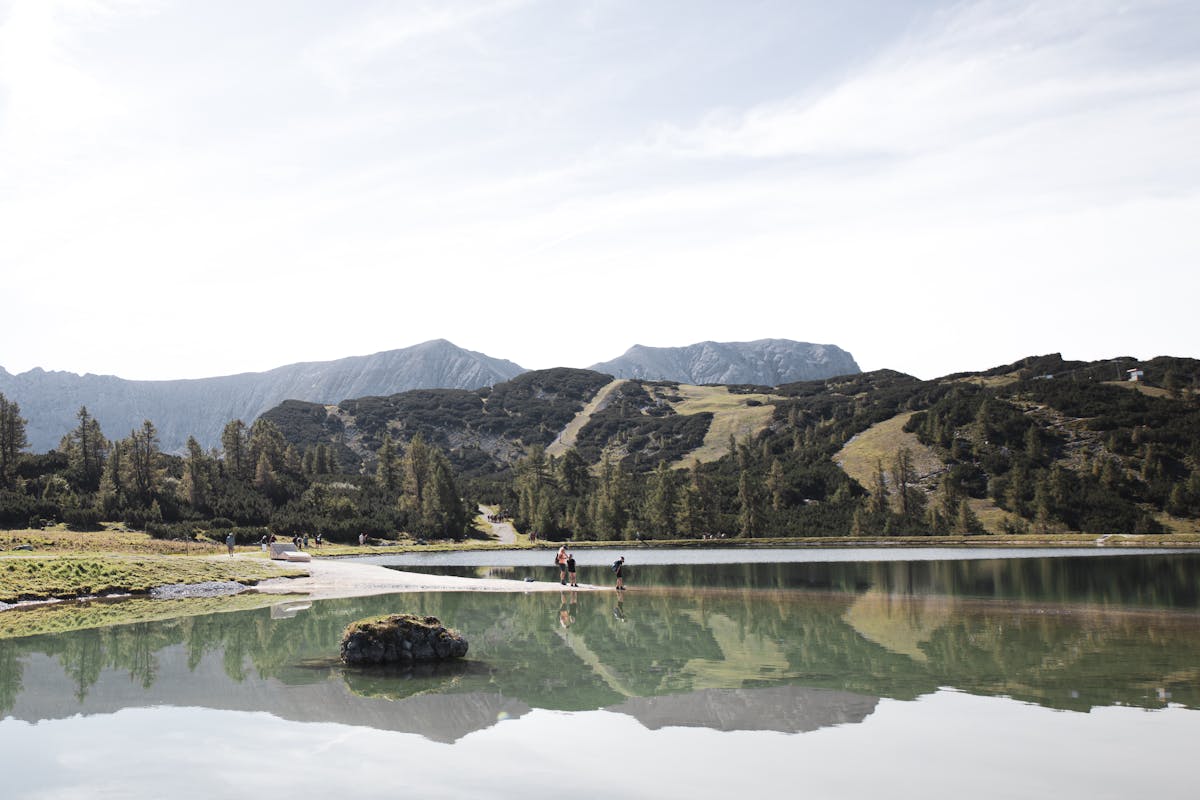 Austrian alpine lake surrounded by green mountains