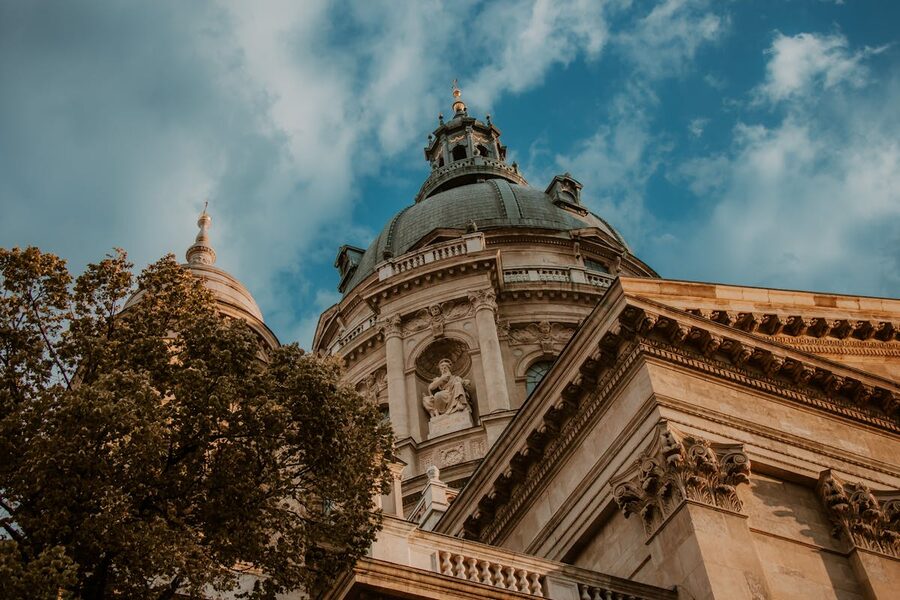 Low angle exterior view of St. Stephen's Basilica showing neo-classical architecture and dome