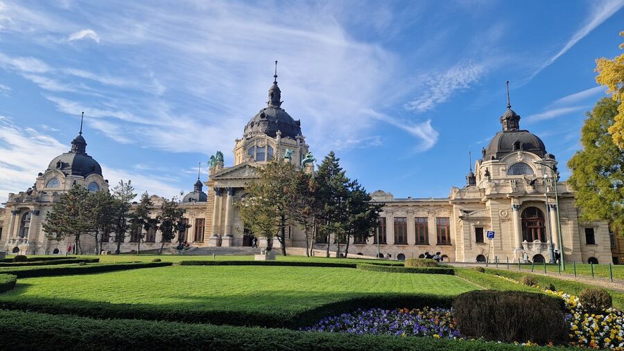 Visitors relaxing in outdoor thermal pool at Szechenyi Baths Budapest