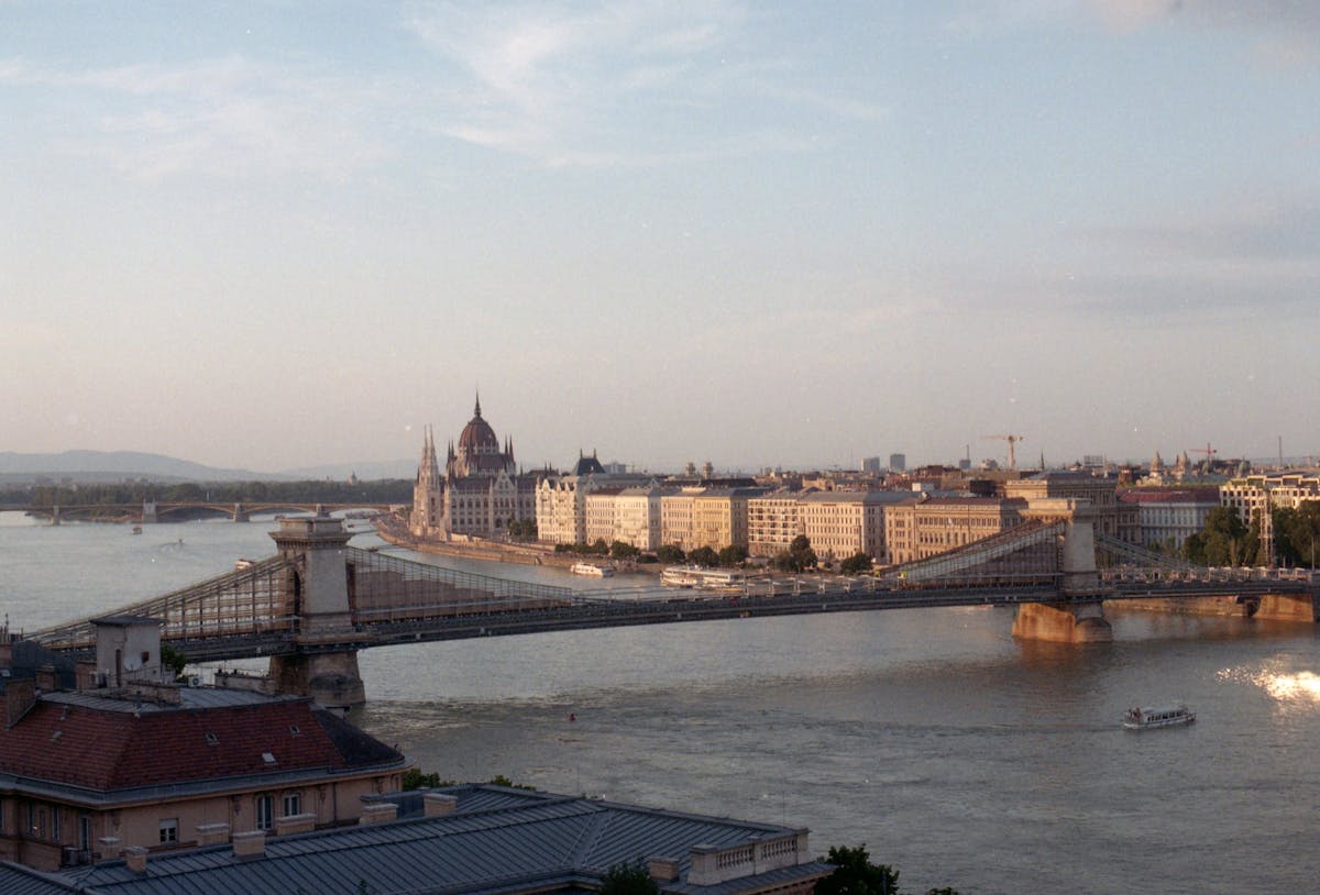 Szechenyi Chain Bridge at sunset with Parliament in the background in Budapest