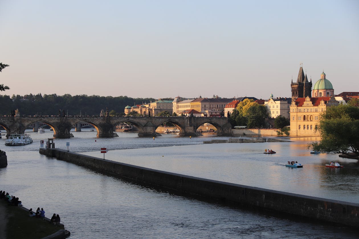 Sunset view of Charles Bridge spanning the Vltava River in Prague