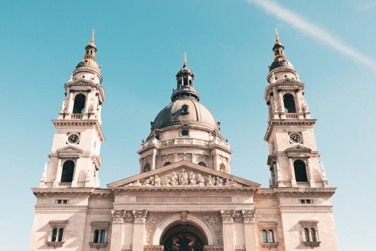 Front view of St Stephens Basilica in Budapest against a clear blue sky