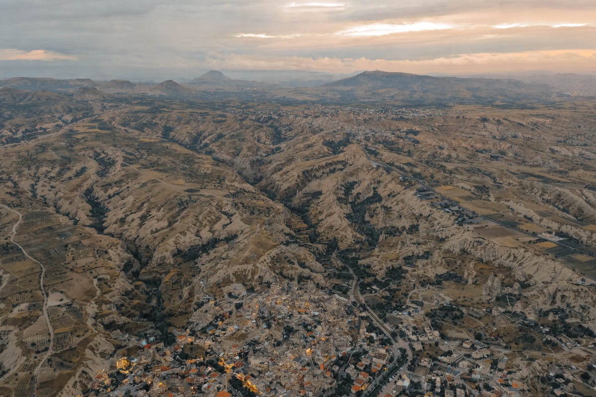 Aerial photograph of Goreme National Park in Cappadocia at dusk showing valleys and rock formations