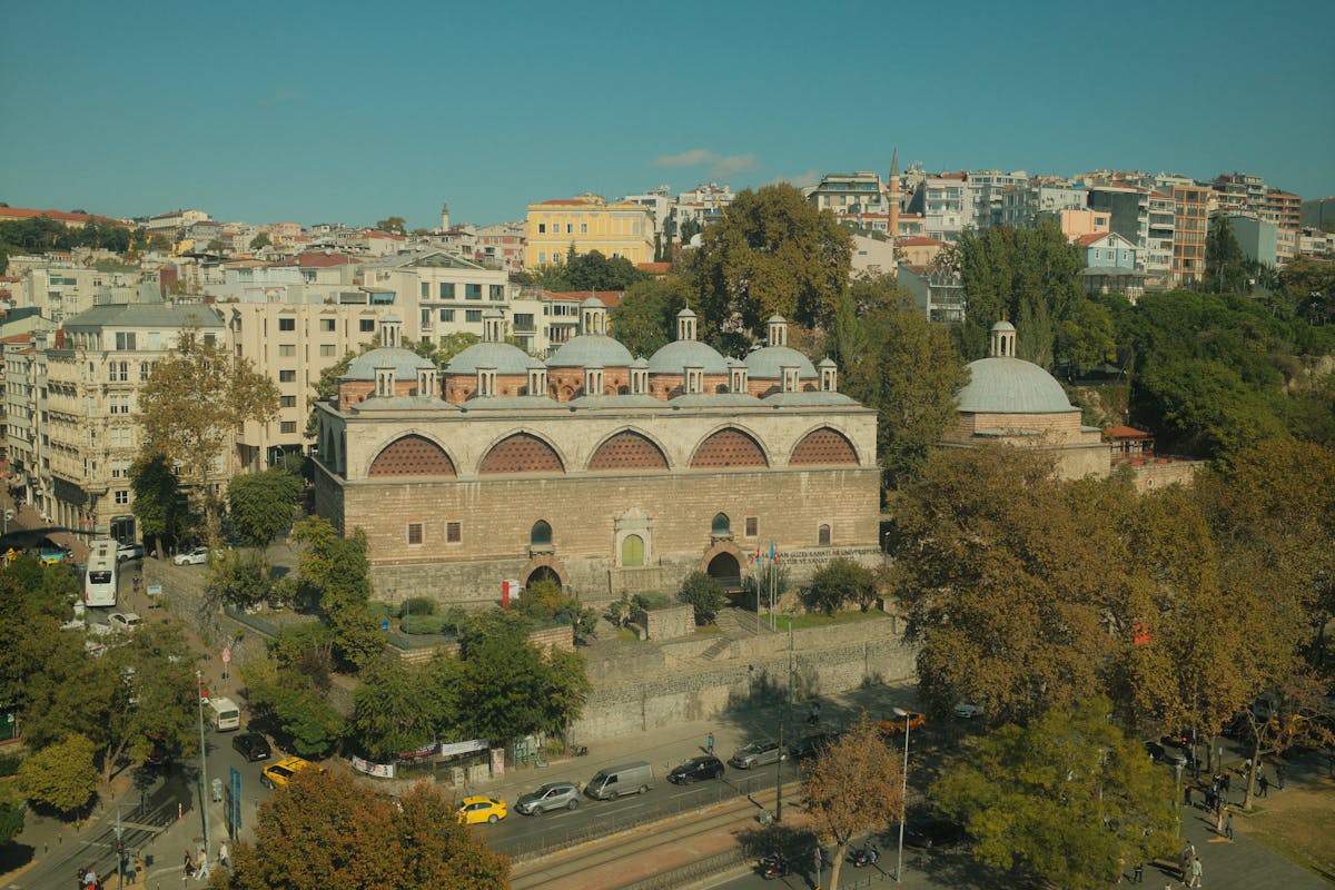 Beams of light entering through small windows in a hamam dome