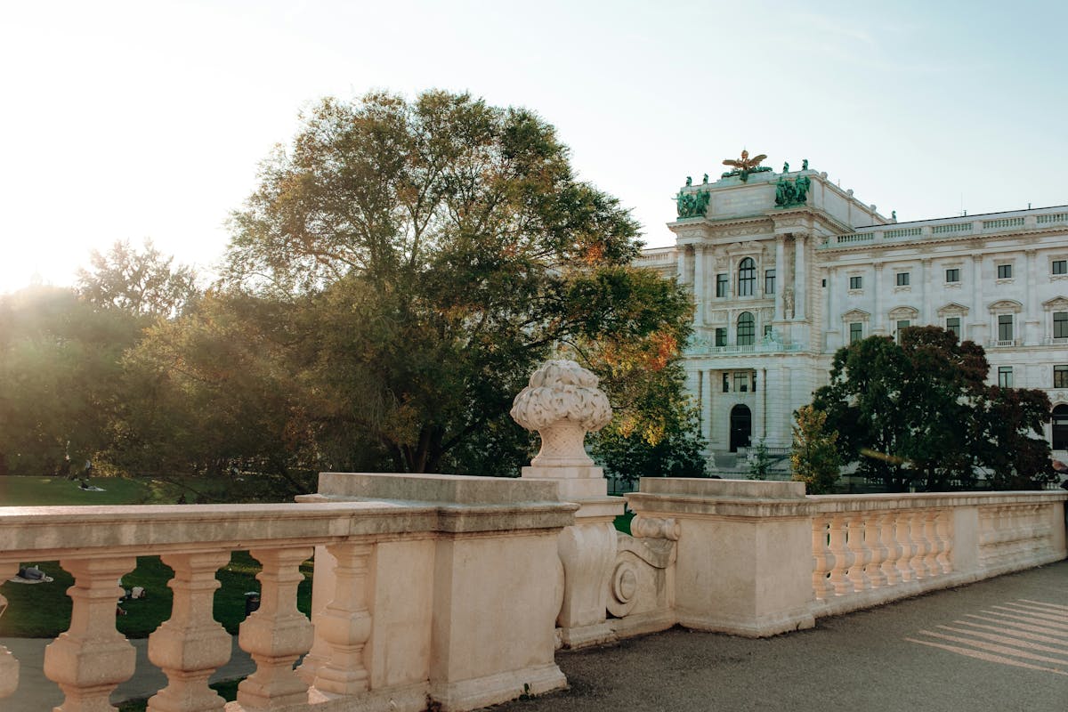 Hofburg Palace in Vienna surrounded by greenery on a sunny day