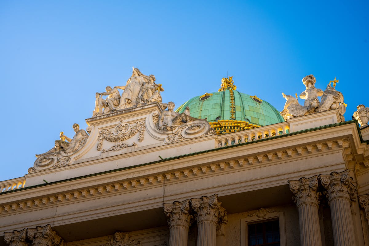 Close-up of the Hofburg Palace ornate dome and sculptures in Vienna Austria