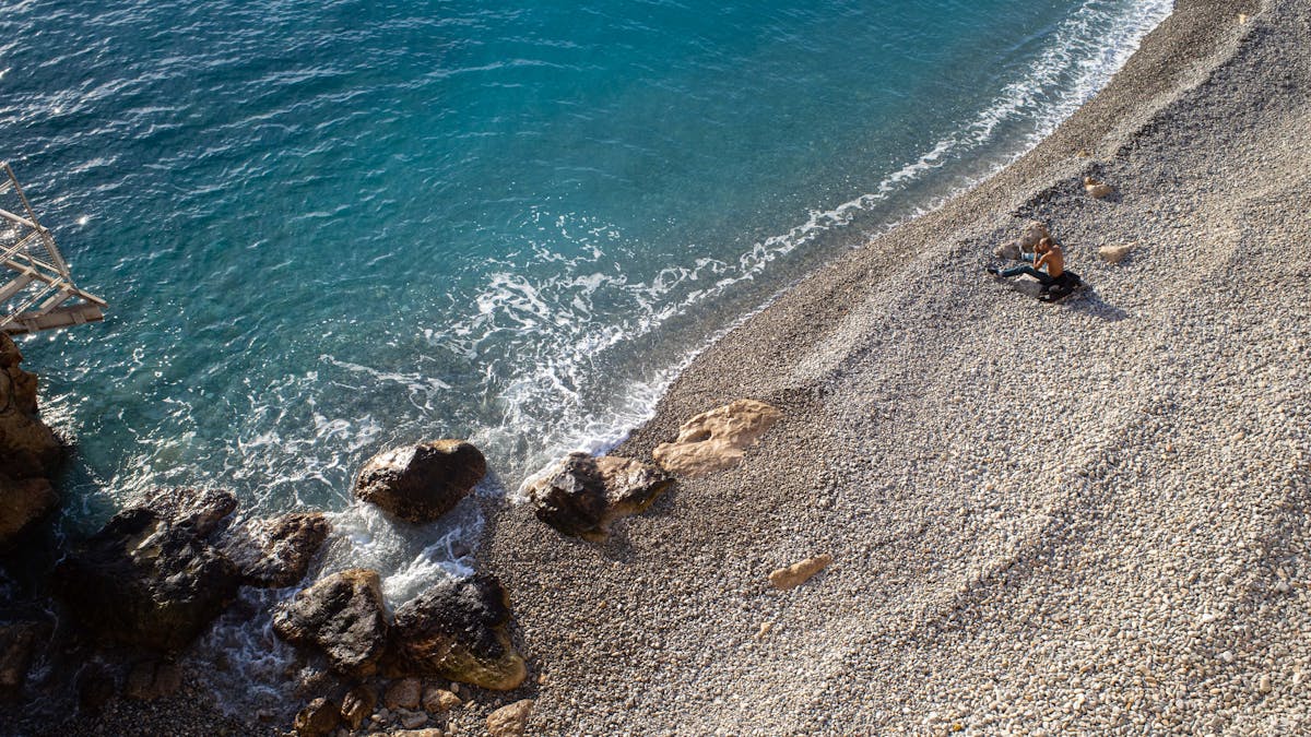 Rocky beach clear blue waters Nice French Riviera
