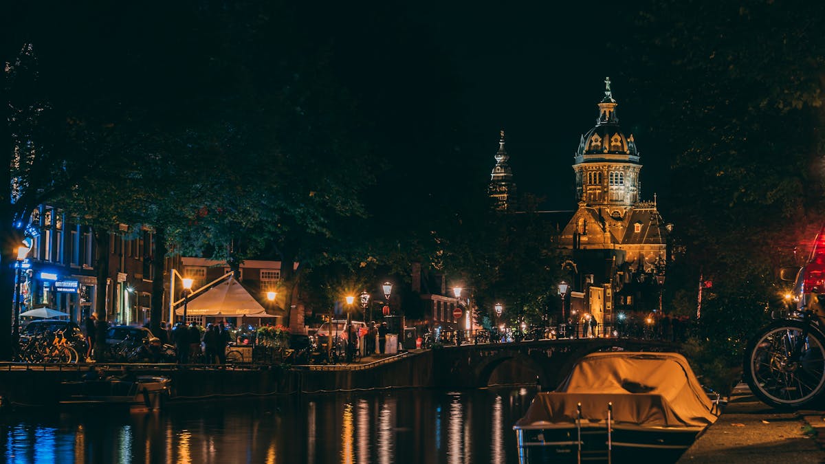 Amsterdam street scene with neon lights at night