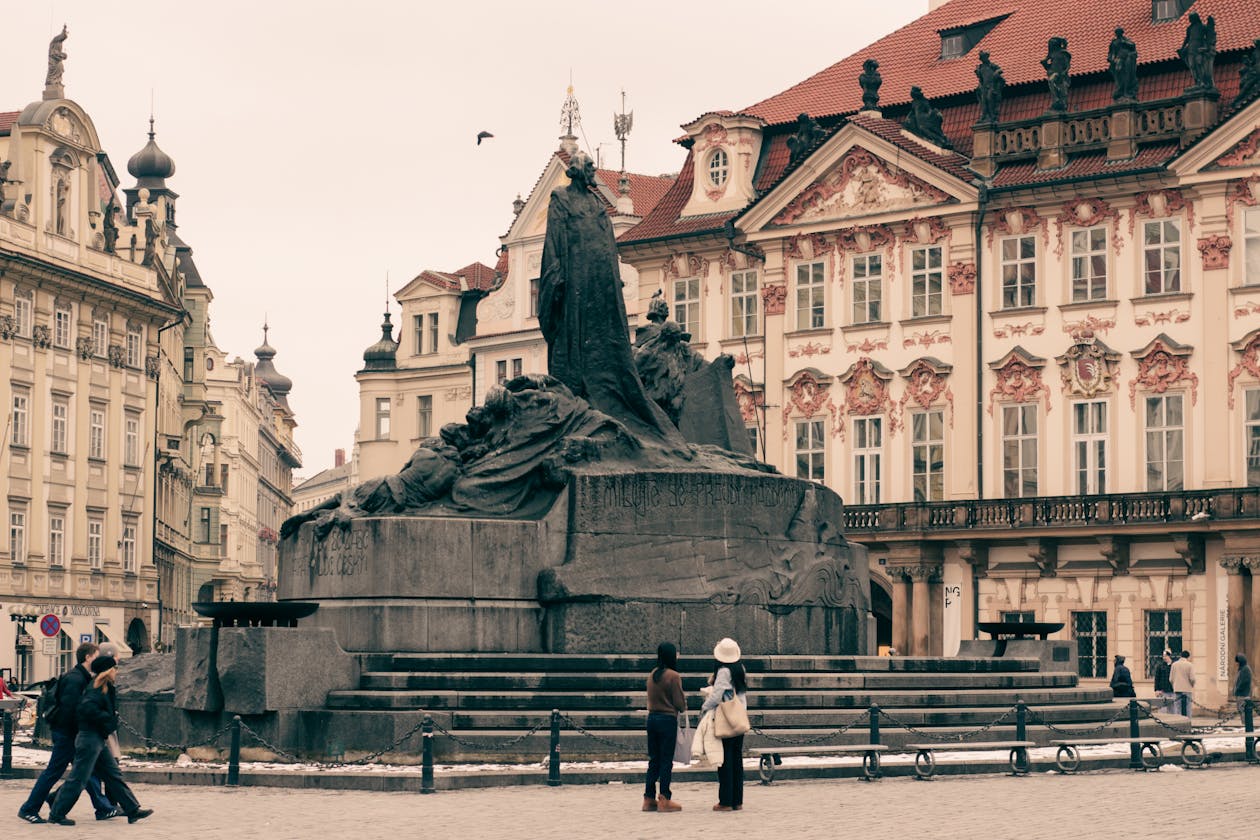 Historic monument in Old Town Square Prague with medieval buildings