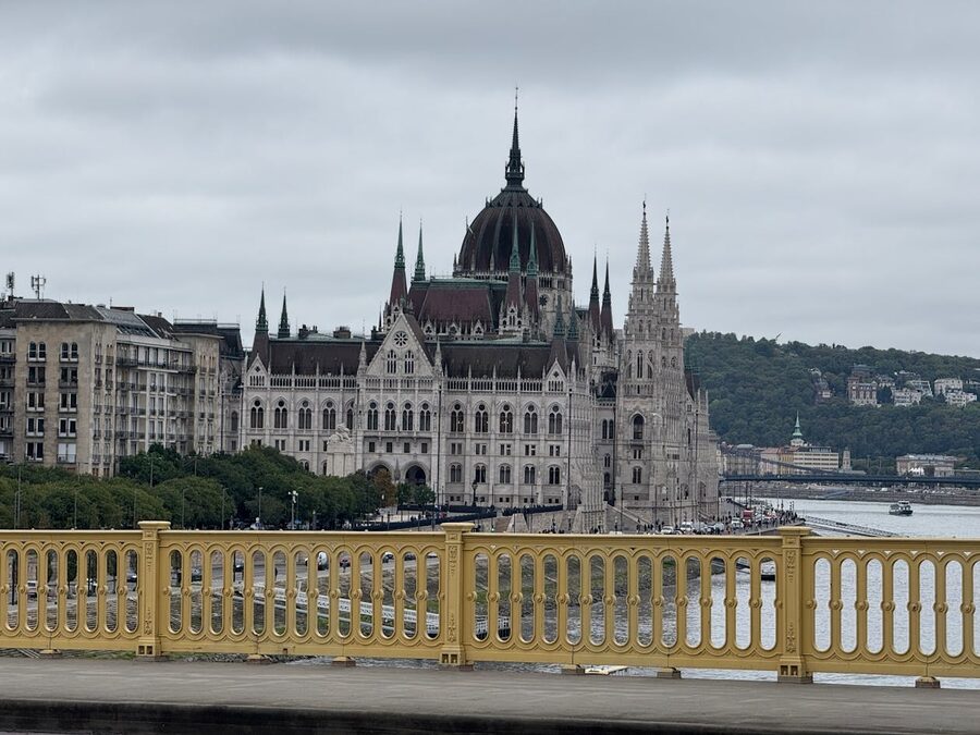 Wide panoramic view of the Hungarian Parliament on the Danube riverbank