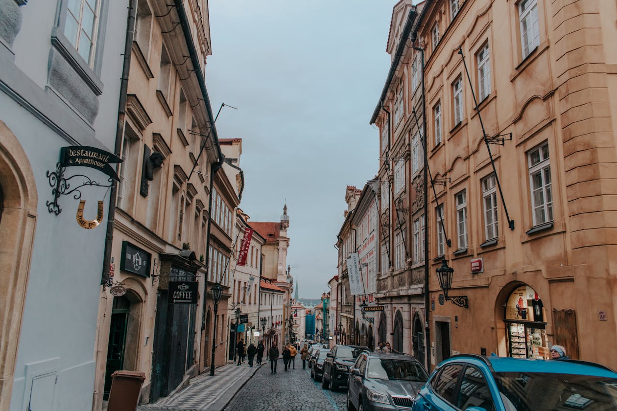 Cobblestone street in historic Prague Old Town with colorful buildings