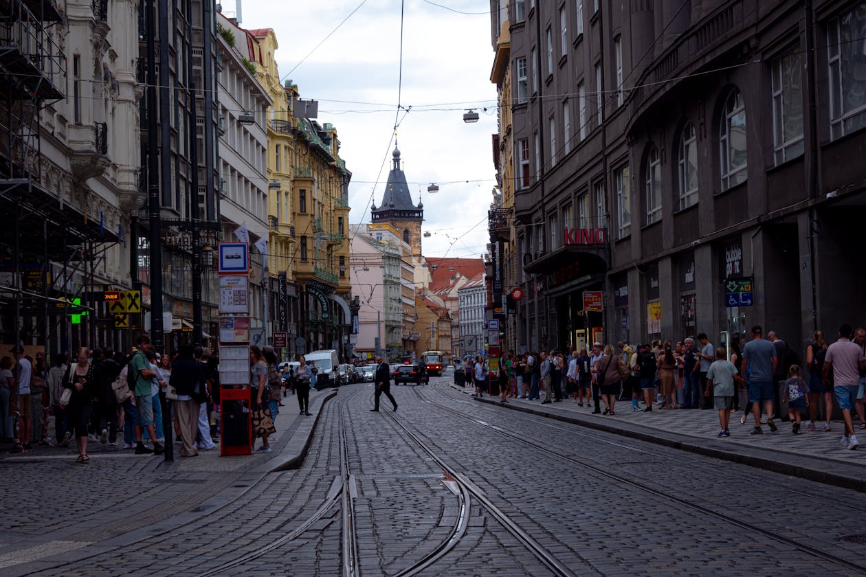Prague street with tram lines and historic buildings