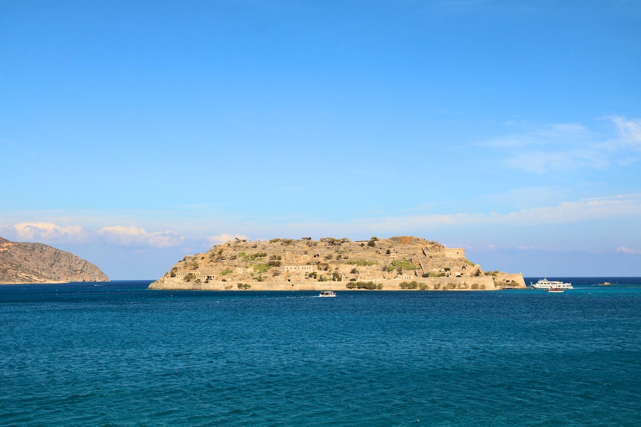 Spinalonga Island seen from across the blue waters of Mirabello Bay