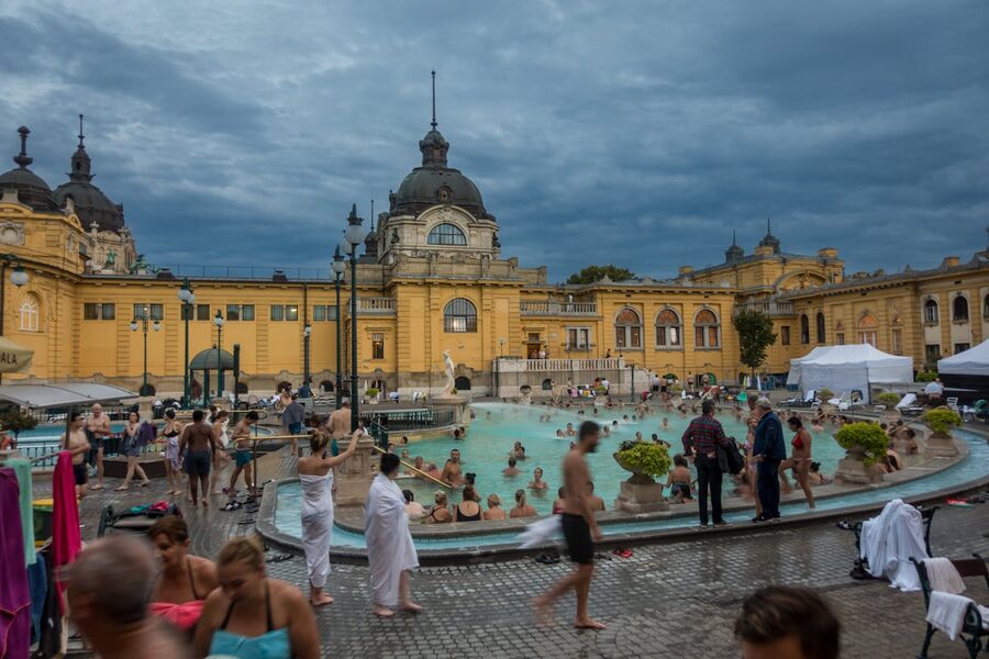 Thermal bath pool with warm turquoise water and classical architecture in Budapest