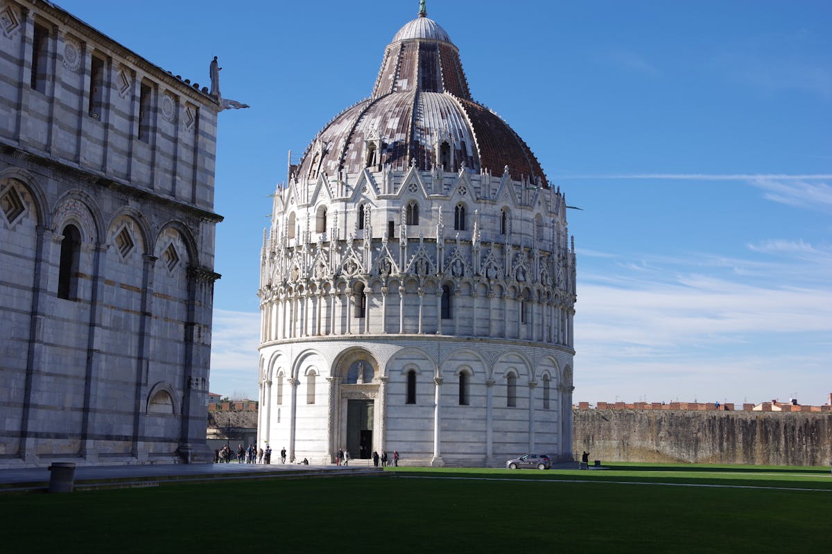 Wide view of the Piazza dei Miracoli showing the Leaning Tower, Cathedral, and Baptistery