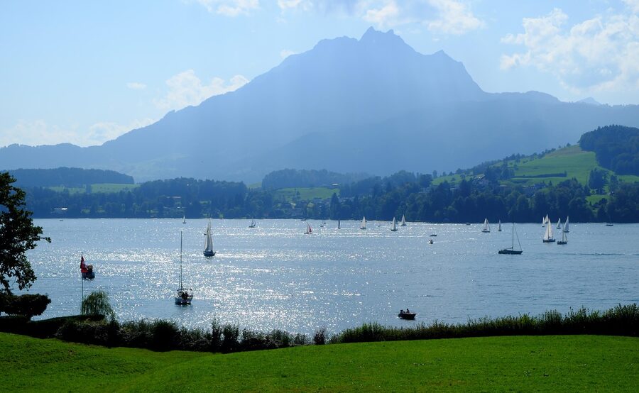 Pilatus mountain with lake and sailboats