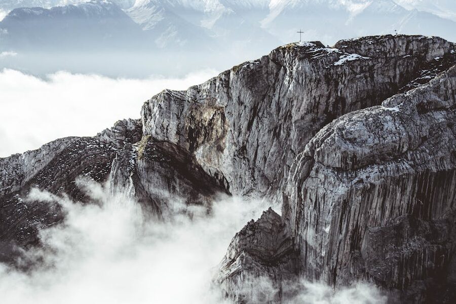 Rugged Pilatus peaks emerging from misty clouds