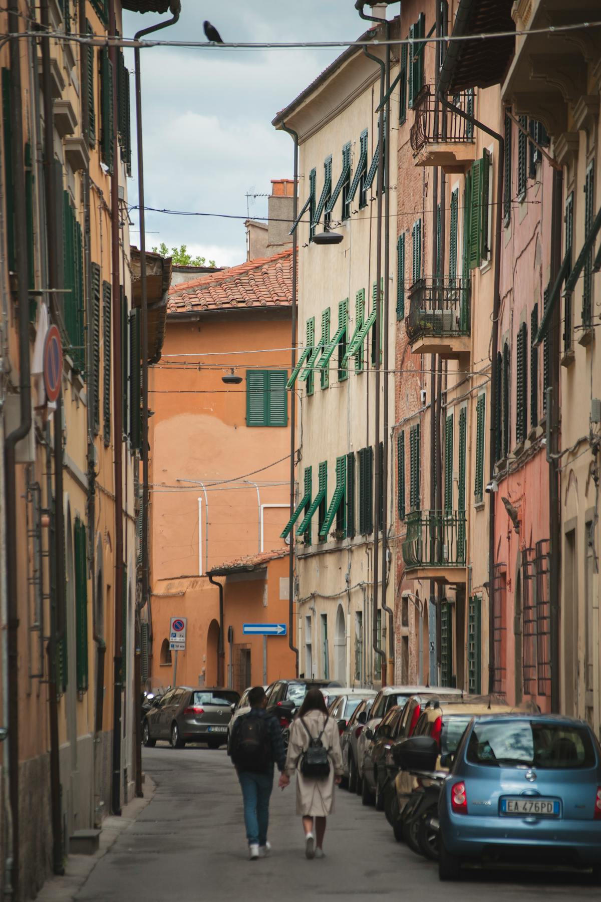 View along the Arno River in Pisa with colorful buildings