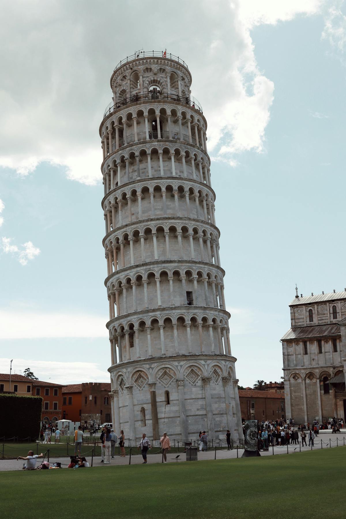 The Leaning Tower of Pisa lit up at dusk