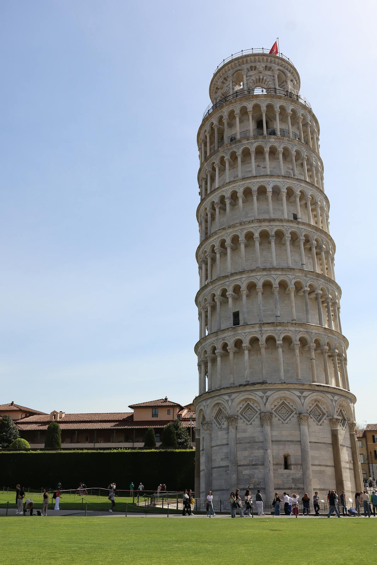 Looking up at the Leaning Tower of Pisa showing its tilt and galleries