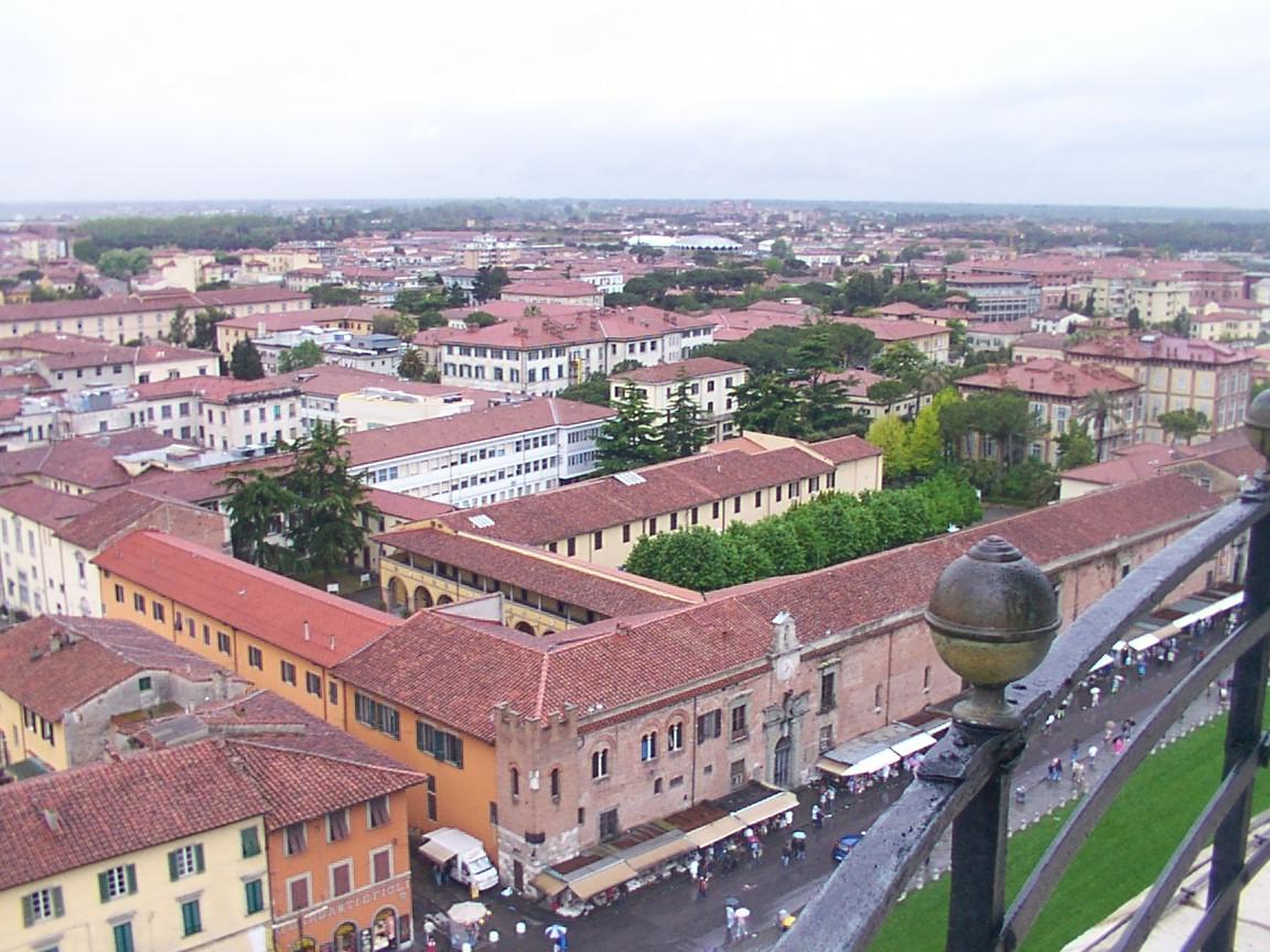 Panoramic view looking out from the top of the Leaning Tower of Pisa over Piazza dei Miracoli