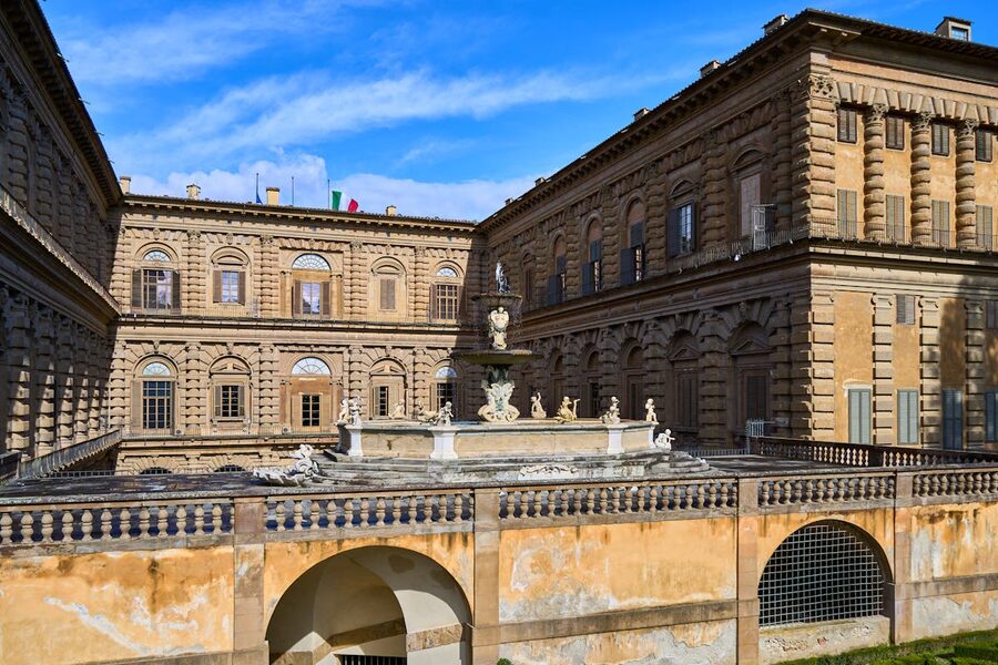 Interior courtyard of Pitti Palace in Florence with central fountain and Renaissance architecture
