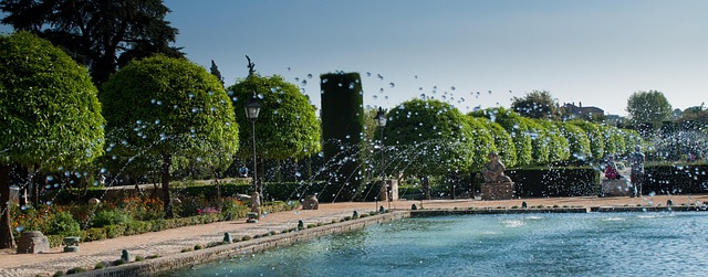 Exterior view of Alcazar de los Reyes Cristianos showing fortress walls and gardens