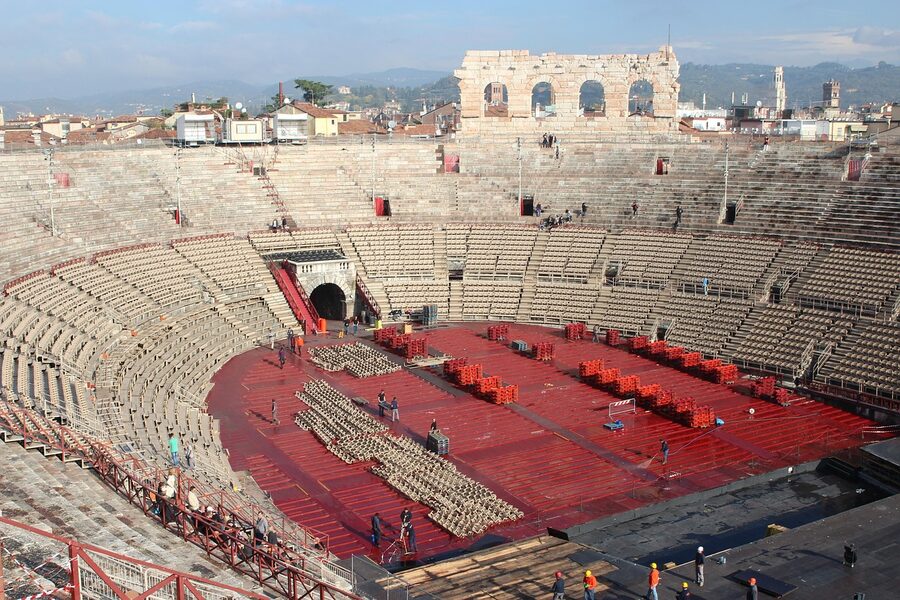 Interior view of the Arena di Verona showing stone seating tiers and stage area