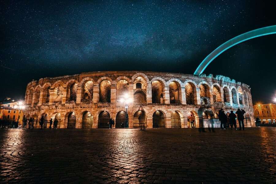 The Arena di Verona amphitheatre illuminated at night in Piazza Bra