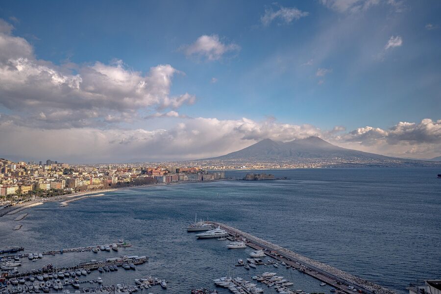 Naples Gulf coastline with boats and Vesuvius in the background