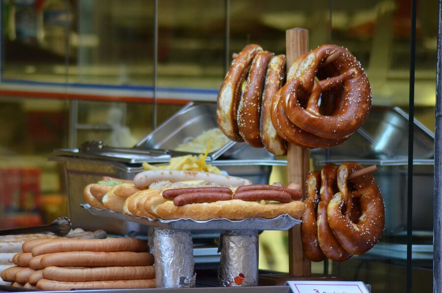 Traditional Alsatian pretzels and sausage displayed at a market stand in Strasbourg