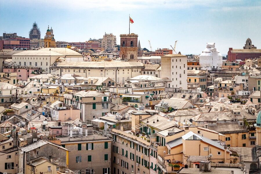 Genoa city architecture featuring a church dome and colourful buildings in Liguria Italy