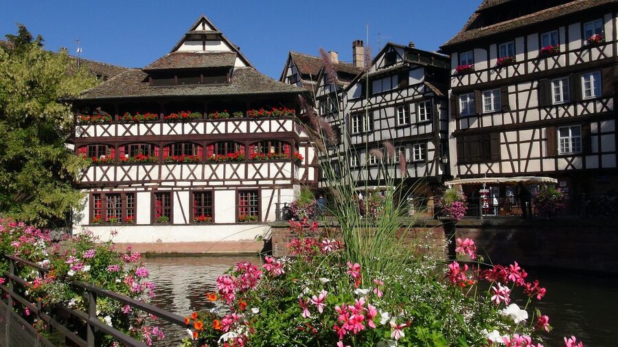 Wide panoramic view of Petite France quarter in Strasbourg showing canals and half-timbered houses