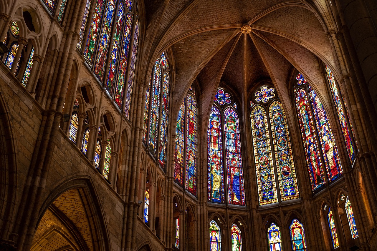 Cathedral interior with vaulted ceiling stained glass and architectural details