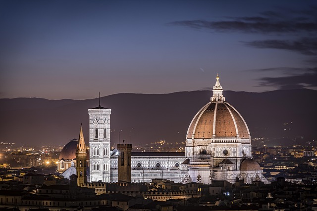 Florence Cathedral illuminated at night with city lights