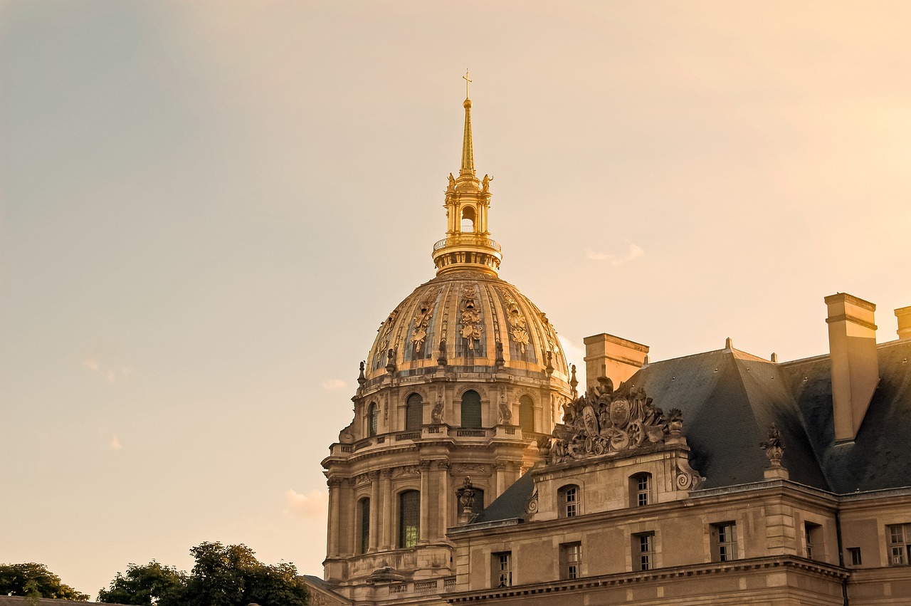 The golden dome of Les Invalides standing tall against a clear sky in Paris