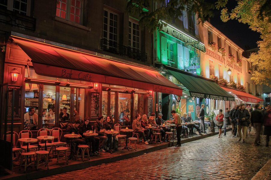 Montmartre neighbourhood in Paris glowing warmly at night