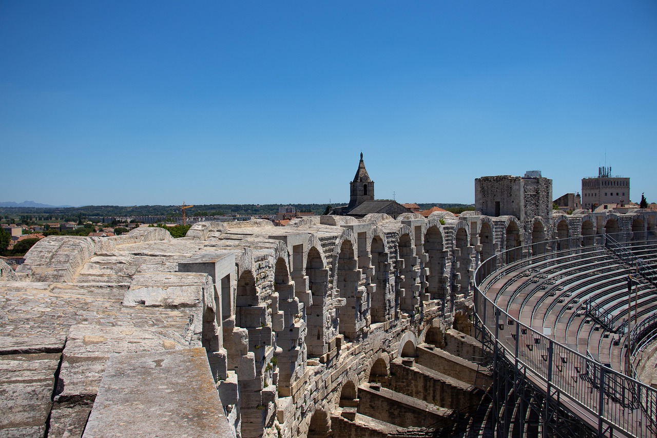 Arles amphitheatre France Roman architecture in summer under blue sky
