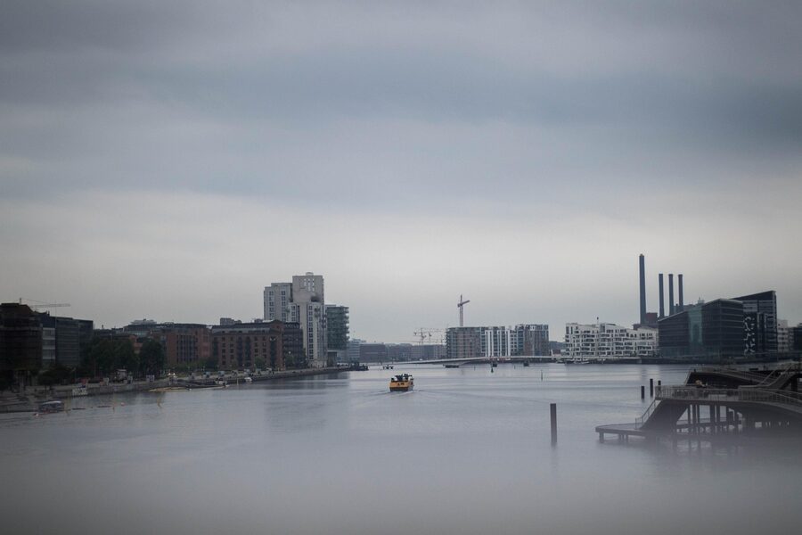 Copenhagen cityscape with bridge and river on a moody day