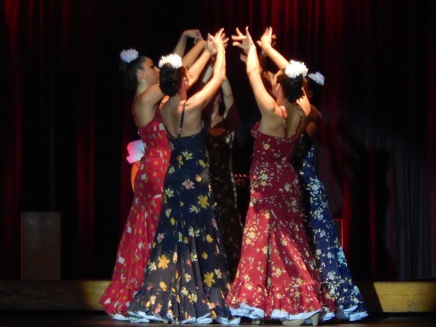 Flamenco dancers performing on stage during a show