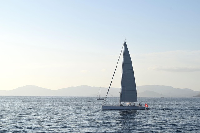 Sailboat near Formentera island beach with clear Mediterranean water and sand