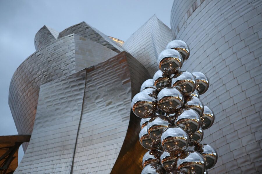 Guggenheim Museum Bilbao at night with river reflections