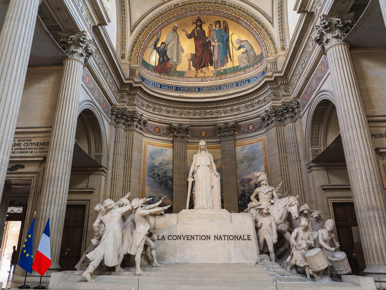 Interior of the Pantheon in Paris showing the grand hall with statues and columns