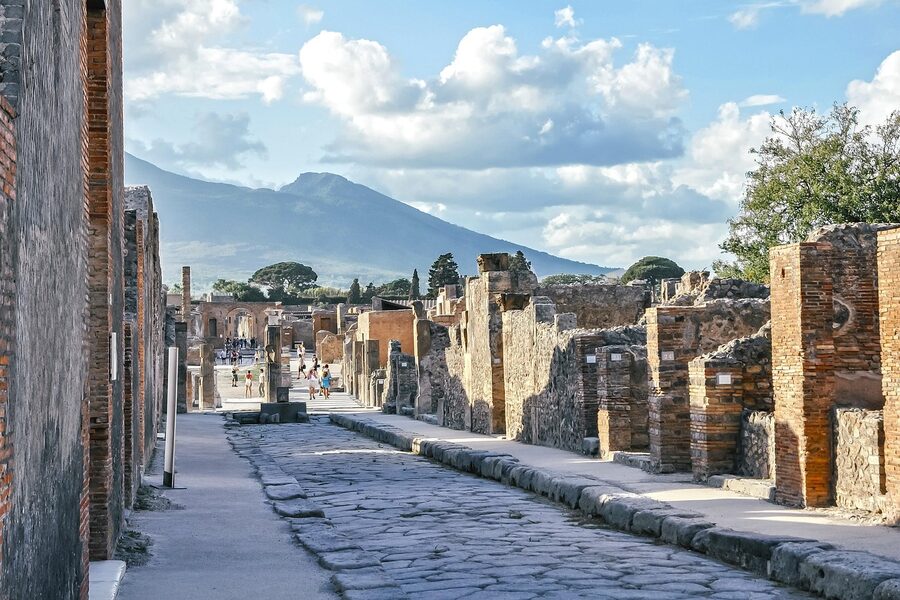 Ancient Roman street in Pompeii with Vesuvius in the background