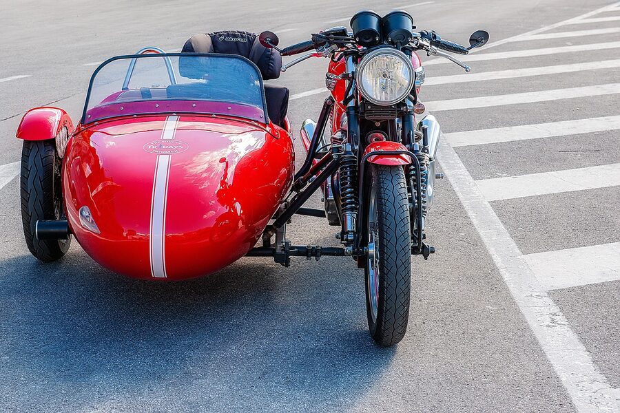 Classic sidecar motorcycle on a scenic road trip