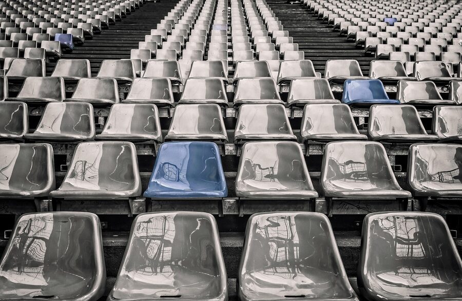 Empty stadium rows of seats in a football ground